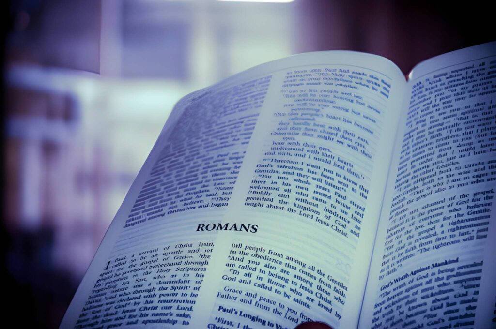 open bible pages with a blue hue