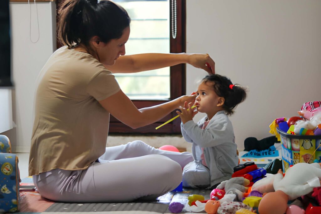 A Mother fixing her daughter's hair