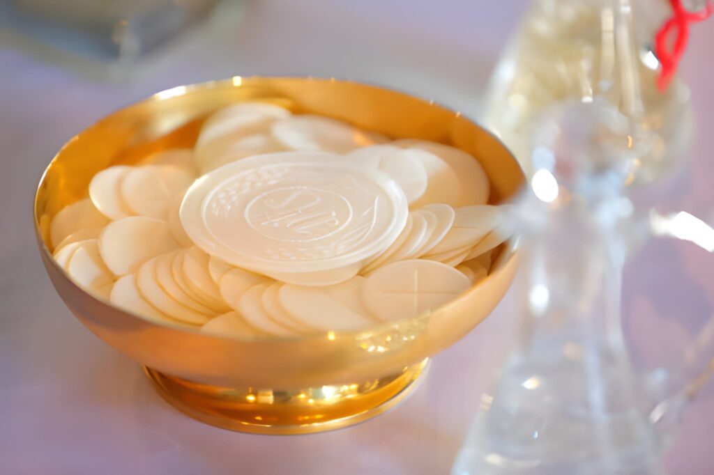 Holy communion in a golden bowl