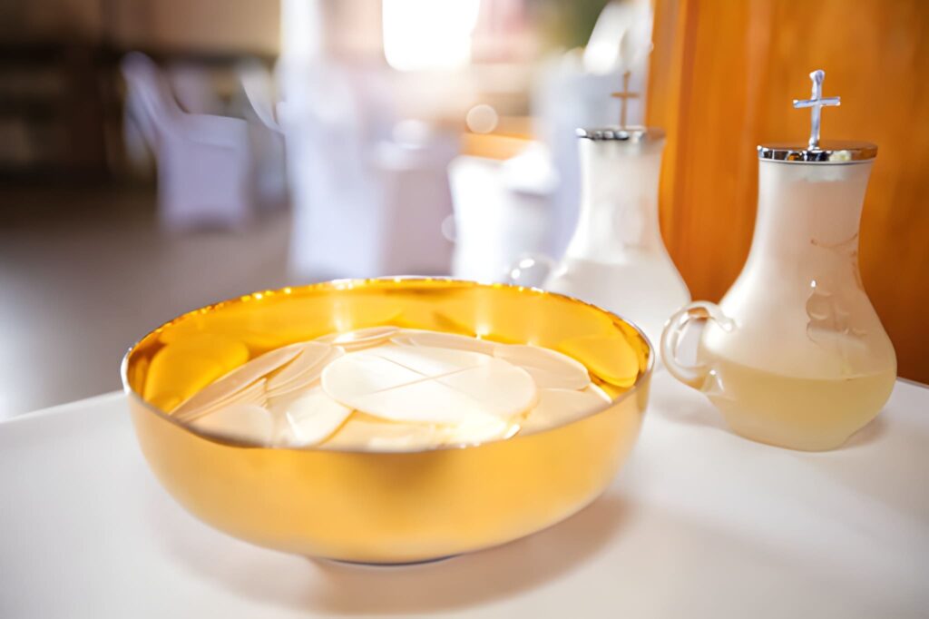 Holy communion in a golden bowl
