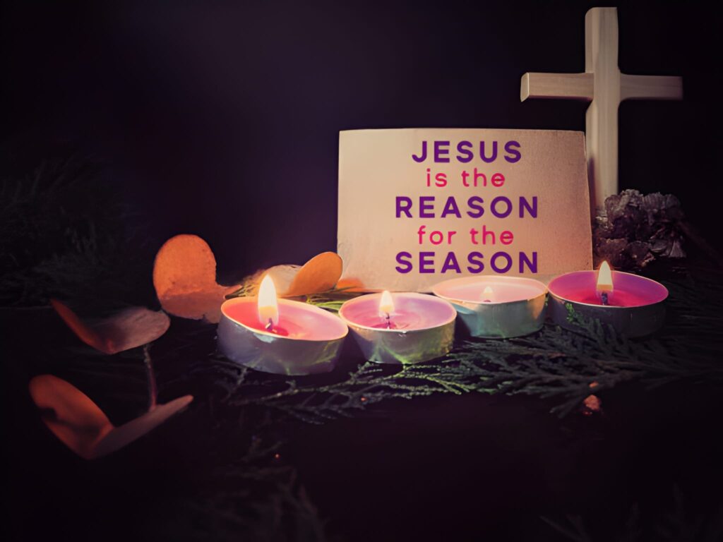Jesus is the reason for the season text on paper with candles background
